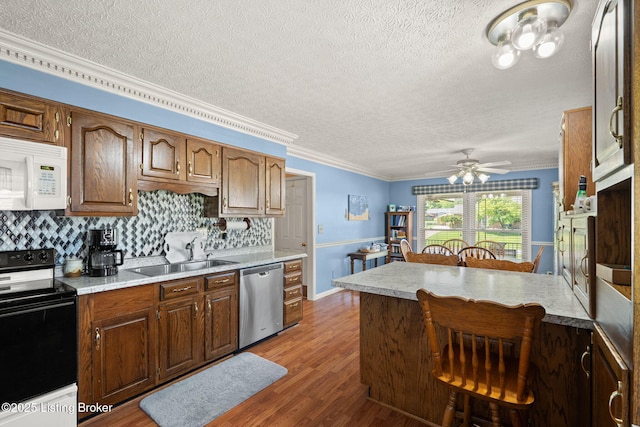 3941 Scenic Trl, Shepherdsville, KY 40165 - kitchen with dishwasher, electric range oven, white microwave, a textured ceiling, and a breakfast bar area