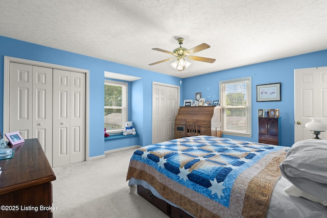 3941 Scenic Trl, Shepherdsville, KY 40165 - bedroom with multiple closets, carpet floors, a ceiling fan, and a textured ceiling