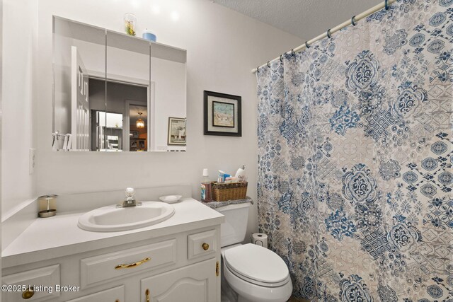 3941 Scenic Trl, Shepherdsville, KY 40165 - bathroom with vanity, curtained shower, and a textured ceiling