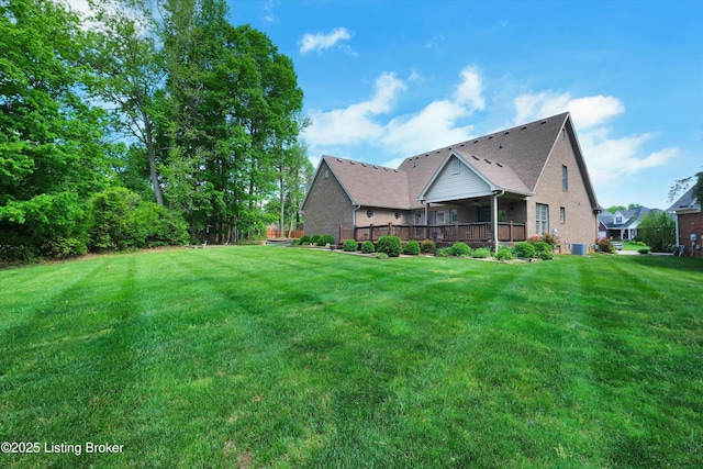 7728 Cottage Cove Way, Louisville, KY 40214 - view of green lawn with a wooden deck