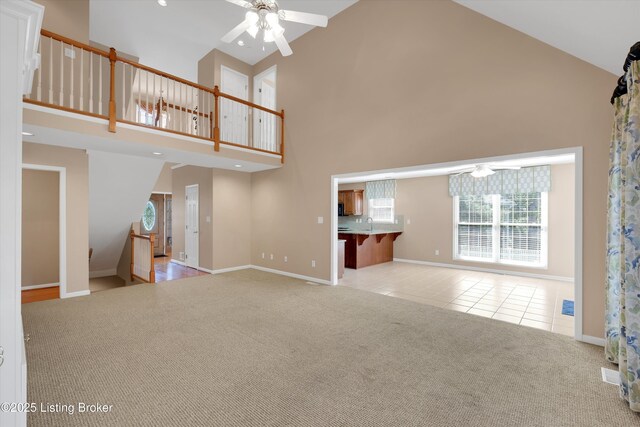7728 Cottage Cove Way, Louisville, KY 40214 - unfurnished living room with a ceiling fan, high vaulted ceiling, carpet flooring, tile patterned flooring, and recessed lighting
