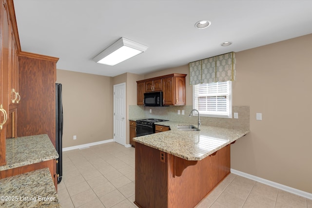 7728 Cottage Cove Way, Louisville, KY 40214 - kitchen featuring black appliances, a peninsula, light tile patterned floors, a breakfast bar, and recessed lighting
