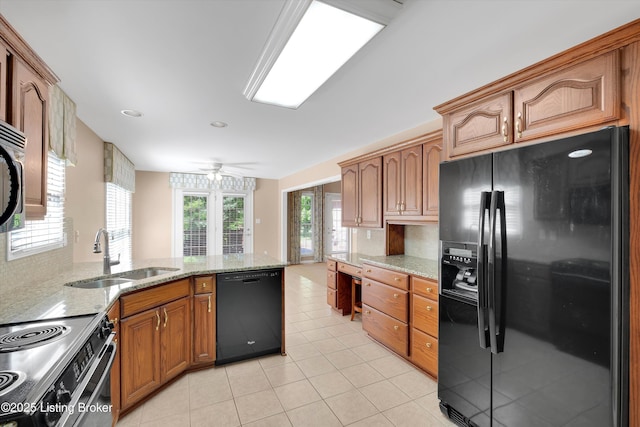 7728 Cottage Cove Way, Louisville, KY 40214 - kitchen featuring black appliances, light tile patterned floors, a peninsula, light stone countertops, and recessed lighting