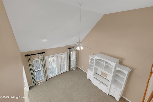 7728 Cottage Cove Way, Louisville, KY 40214 - empty room with light carpet, ceiling fan, and high vaulted ceiling