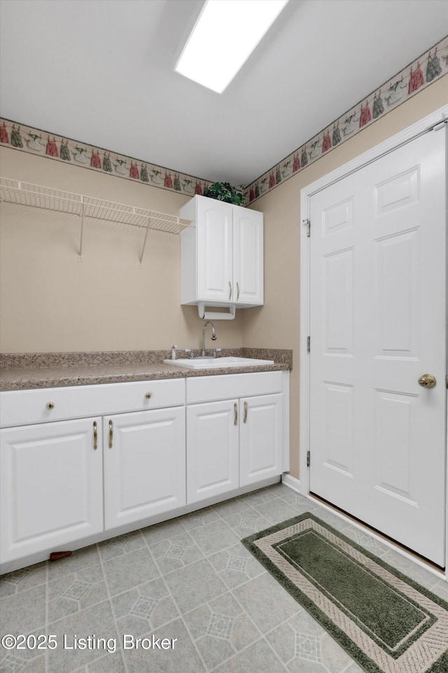 7728 Cottage Cove Way, Louisville, KY 40214 - washroom with a sink and baseboards
