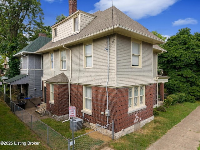 1246 Ormsby Ct, Louisville, KY 40203 - view of property exterior featuring a chimney and roof with shingles