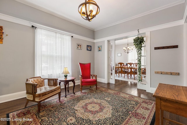 1246 Ormsby Ct, Louisville, KY 40203 - sitting room featuring a chandelier, wood finished floors, plenty of natural light, and crown molding