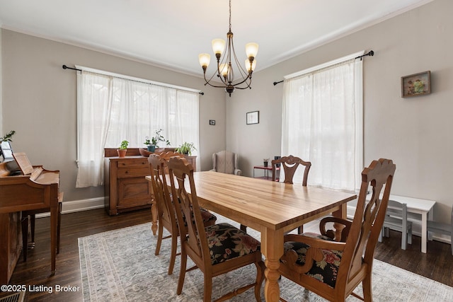 1246 Ormsby Ct, Louisville, KY 40203 - dining space with a chandelier, dark wood-style flooring, and crown molding