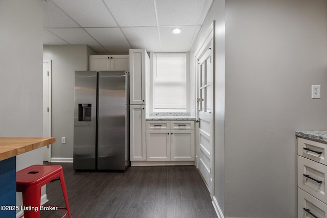 1246 Ormsby Ct, Louisville, KY 40203 - kitchen featuring stainless steel fridge with ice dispenser, wood counters, dark wood-style floors, and white cabinetry