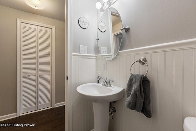 1246 Ormsby Ct, Louisville, KY 40203 - half bathroom with a wainscoted wall and wood finished floors
