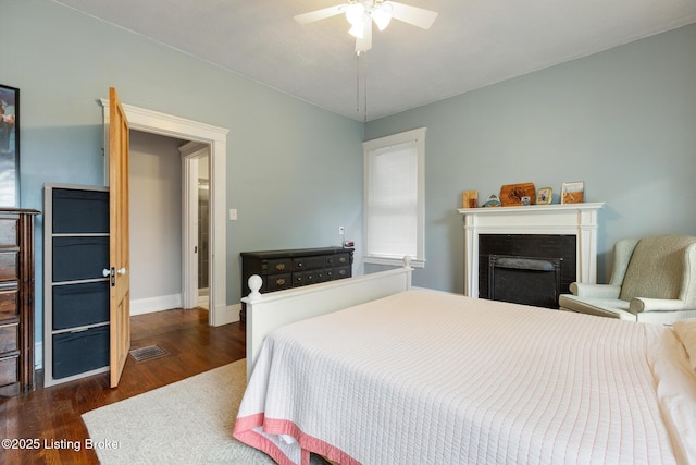 1246 Ormsby Ct, Louisville, KY 40203 - bedroom featuring wood finished floors, a fireplace, and ceiling fan