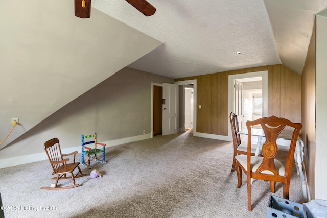 1246 Ormsby Ct, Louisville, KY 40203 - living area featuring vaulted ceiling, carpet, a ceiling fan, and a textured ceiling