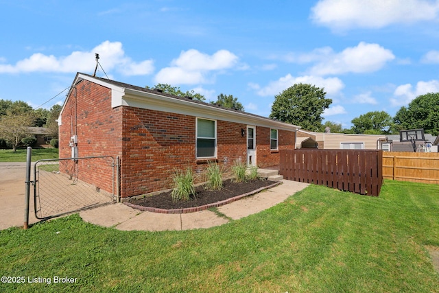 180 Summers Dr, Shepherdsville, KY 40229 - rear view of house featuring brick siding and a gate
