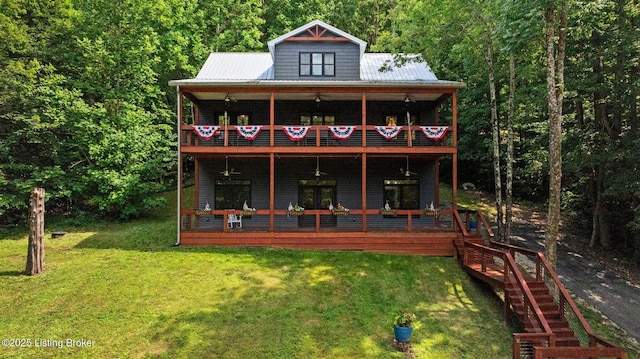 422 Lilac Ln, Cub Run, KY 42729 - back of property featuring a balcony, a yard, a view of trees, and a metal roof