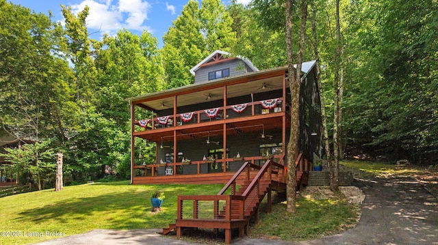 422 Lilac Ln, Cub Run, KY 42729 - chalet / cabin featuring a ceiling fan, a front lawn, a wooden deck, and stairway