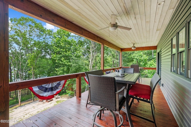 422 Lilac Ln, Cub Run, KY 42729 - wooden deck with a ceiling fan, outdoor dining space, and view of scattered trees