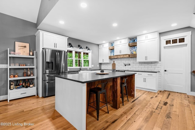 422 Lilac Ln, Cub Run, KY 42729 - kitchen with stainless steel fridge with ice dispenser, open shelves, dark countertops, light wood-style flooring, and recessed lighting