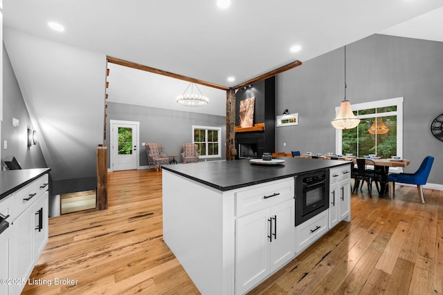 422 Lilac Ln, Cub Run, KY 42729 - kitchen with dark countertops, light wood finished floors, white cabinetry, and recessed lighting