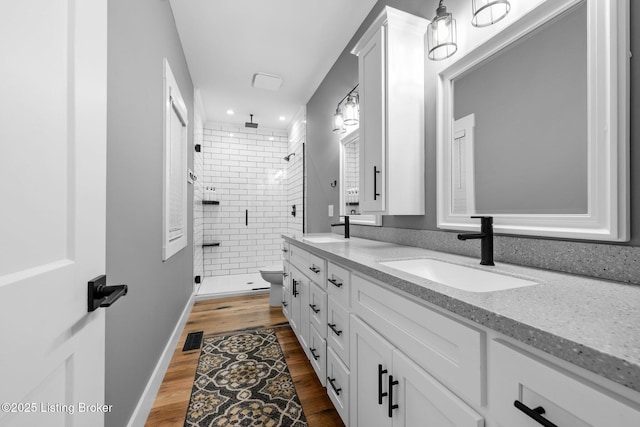 422 Lilac Ln, Cub Run, KY 42729 - bathroom with a shower stall, double vanity, wood finished floors, and recessed lighting