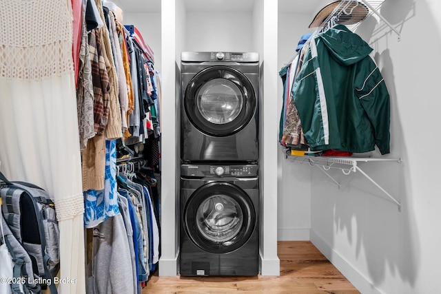 422 Lilac Ln, Cub Run, KY 42729 - laundry area with stacked washer / dryer and wood finished floors