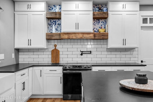 422 Lilac Ln, Cub Run, KY 42729 - kitchen with open shelves, electric range, dark countertops, and white cabinetry