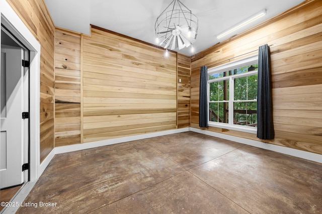 422 Lilac Ln, Cub Run, KY 42729 - unfurnished room featuring wooden walls, a chandelier, and concrete flooring
