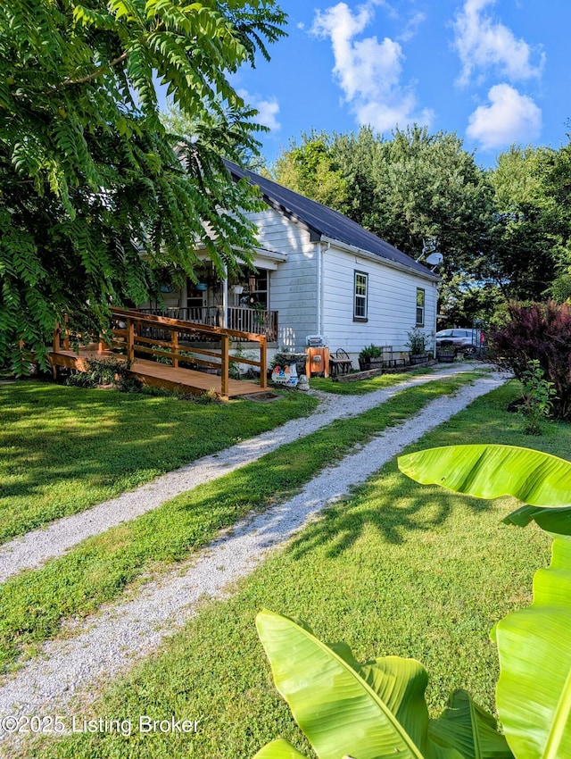 118 Hardin Spring Rd, Big Clifty, KY 42712 - view of grassy yard with a deck and driveway