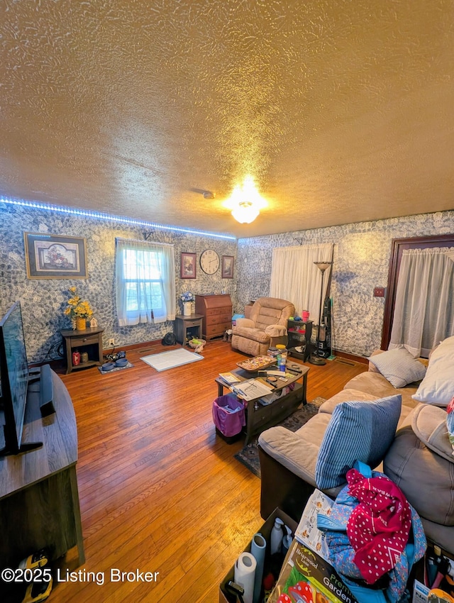 118 Hardin Spring Rd, Big Clifty, KY 42712 - living room with wallpapered walls, a textured ceiling, and hardwood / wood-style floors