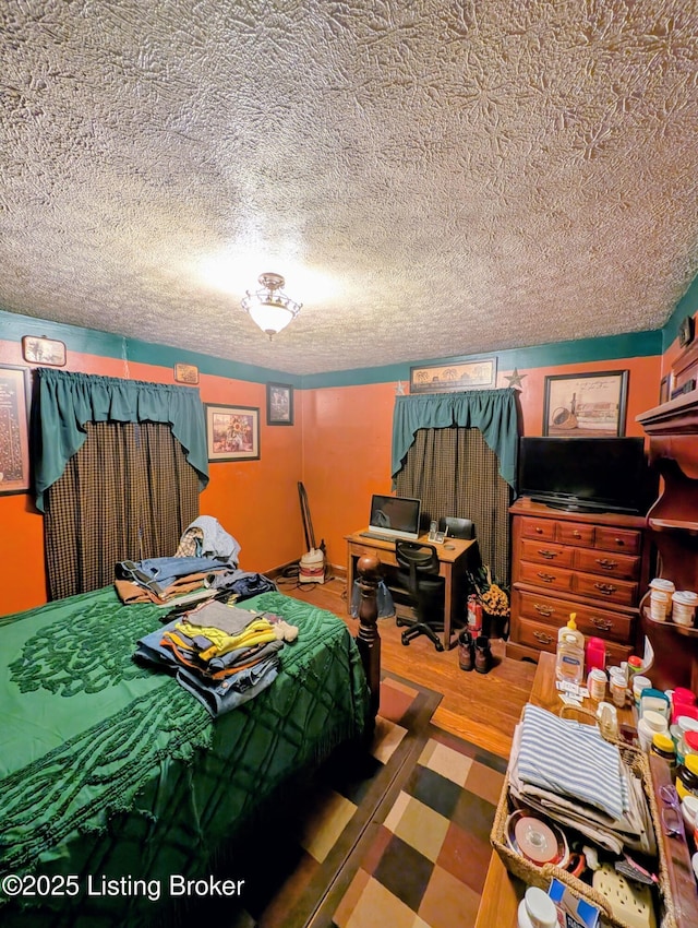 118 Hardin Spring Rd, Big Clifty, KY 42712 - bedroom featuring a textured ceiling and wood finished floors