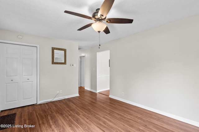 6818 Village Green Blvd, Pewee Valley, KY 40056 - unfurnished bedroom with wood finished floors, a closet, and a ceiling fan