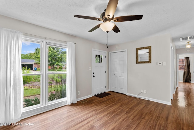 6818 Village Green Blvd, Pewee Valley, KY 40056 - entrance foyer with wood finished floors, a ceiling fan, and a textured ceiling