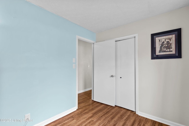 6818 Village Green Blvd, Pewee Valley, KY 40056 - unfurnished bedroom featuring wood finished floors and a closet