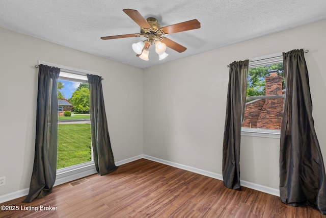 6818 Village Green Blvd, Pewee Valley, KY 40056 - spare room with healthy amount of natural light, wood finished floors, a ceiling fan, and a textured ceiling