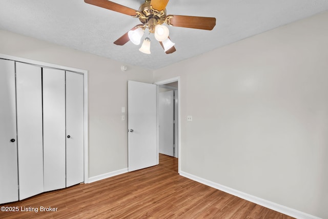 6818 Village Green Blvd, Pewee Valley, KY 40056 - unfurnished bedroom with light wood finished floors, a closet, and a ceiling fan