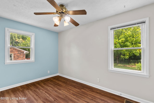 6818 Village Green Blvd, Pewee Valley, KY 40056 - empty room featuring dark wood-style floors, ceiling fan, and a textured ceiling