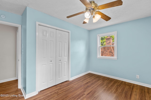 6818 Village Green Blvd, Pewee Valley, KY 40056 - unfurnished bedroom featuring a closet, wood finished floors, ceiling fan, and a textured ceiling