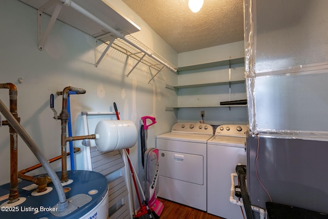 6818 Village Green Blvd, Pewee Valley, KY 40056 - laundry area featuring washing machine and clothes dryer, water heater, a textured ceiling, and wood finished floors