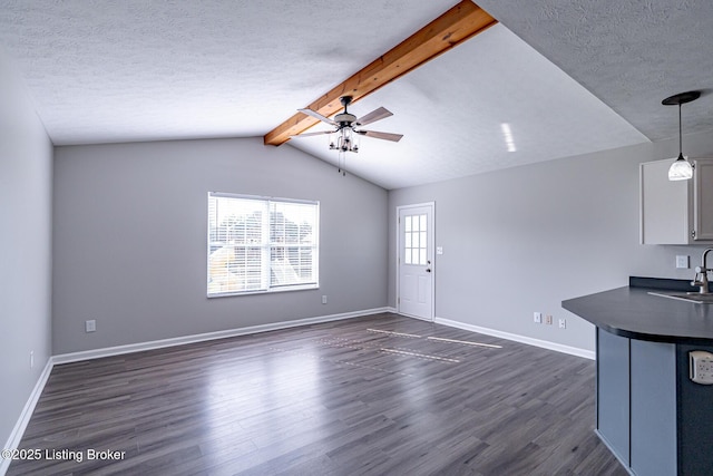 372 Wild Way, Louisville, KY 40229 - unfurnished living room with dark wood finished floors, ceiling fan, and a textured ceiling