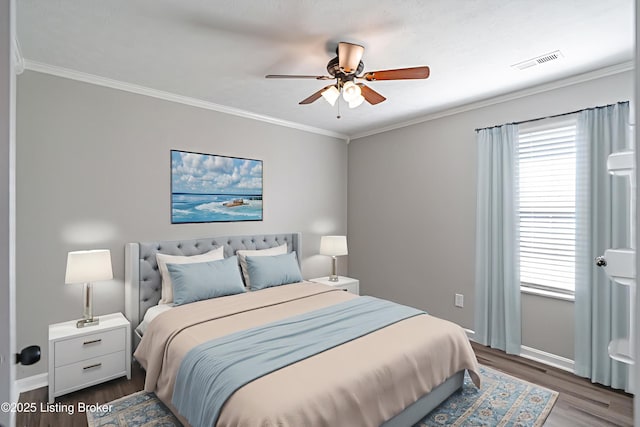 372 Wild Way, Louisville, KY 40229 - bedroom featuring multiple windows, wood finished floors, crown molding, and a ceiling fan