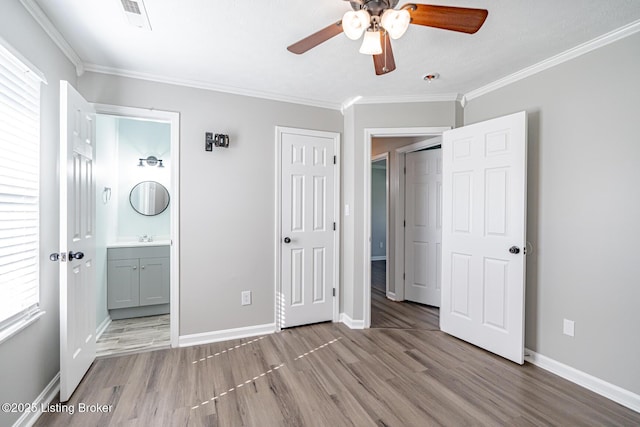 372 Wild Way, Louisville, KY 40229 - unfurnished bedroom with wood finished floors, crown molding, ensuite bath, and a ceiling fan