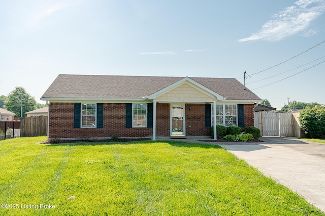 372 Wild Way, Louisville, KY 40229 - view of front of property featuring driveway, brick siding, roof with shingles, and a gate