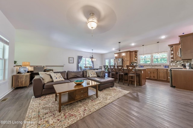 164 Greenshores Circle Ln, Mcdaniels, KY 40152 - living area featuring dark wood-type flooring, healthy amount of natural light, ceiling fan, recessed lighting, and a chandelier