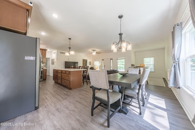 164 Greenshores Circle Ln, Mcdaniels, KY 40152 - dining area featuring light wood-type flooring, a chandelier, and recessed lighting
