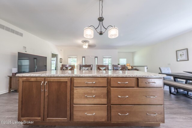 164 Greenshores Circle Ln, Mcdaniels, KY 40152 - kitchen with dark wood finished floors, a chandelier, decorative light fixtures, and open floor plan
