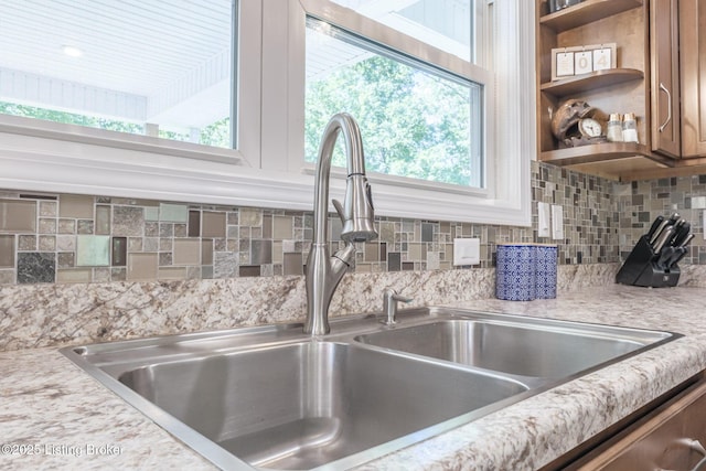 164 Greenshores Circle Ln, Mcdaniels, KY 40152 - kitchen view of light countertops, backsplash, brown cabinetry, and open shelves