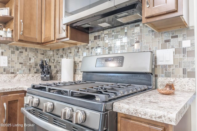 164 Greenshores Circle Ln, Mcdaniels, KY 40152 - kitchen with appliances with stainless steel finishes, brown cabinets, light countertops, tasteful backsplash, and open shelves