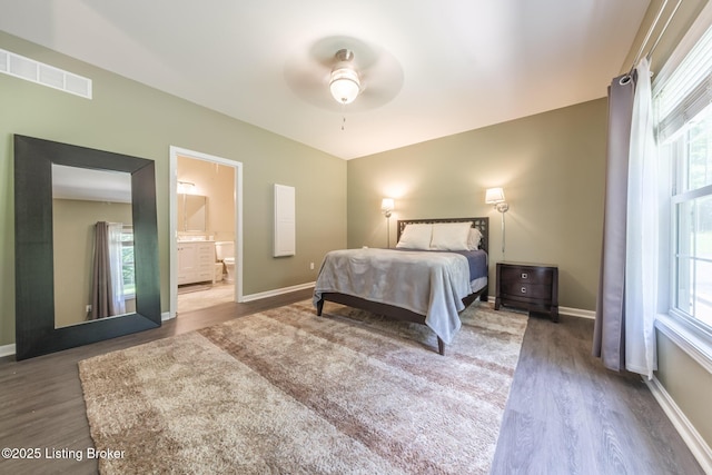 164 Greenshores Circle Ln, Mcdaniels, KY 40152 - bedroom with wood finished floors, multiple windows, ensuite bathroom, and a ceiling fan