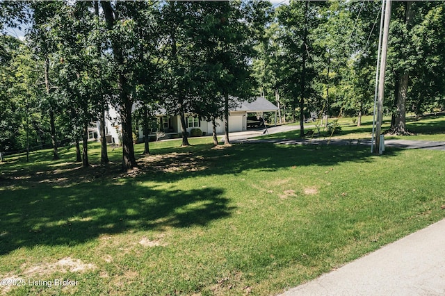 164 Greenshores Circle Ln, Mcdaniels, KY 40152 - view of grassy yard with a garage and concrete driveway