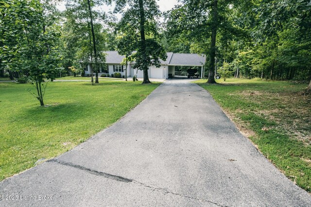 164 Greenshores Circle Ln, Mcdaniels, KY 40152 - view of front of house with asphalt driveway, a front lawn, and a garage