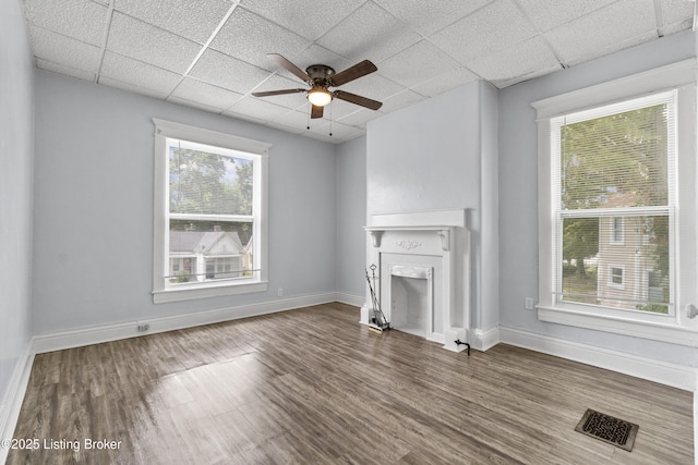 1373 Cypress St, Louisville, KY 40211 - unfurnished living room featuring ceiling fan, wood finished floors, a drop ceiling, and a fireplace
